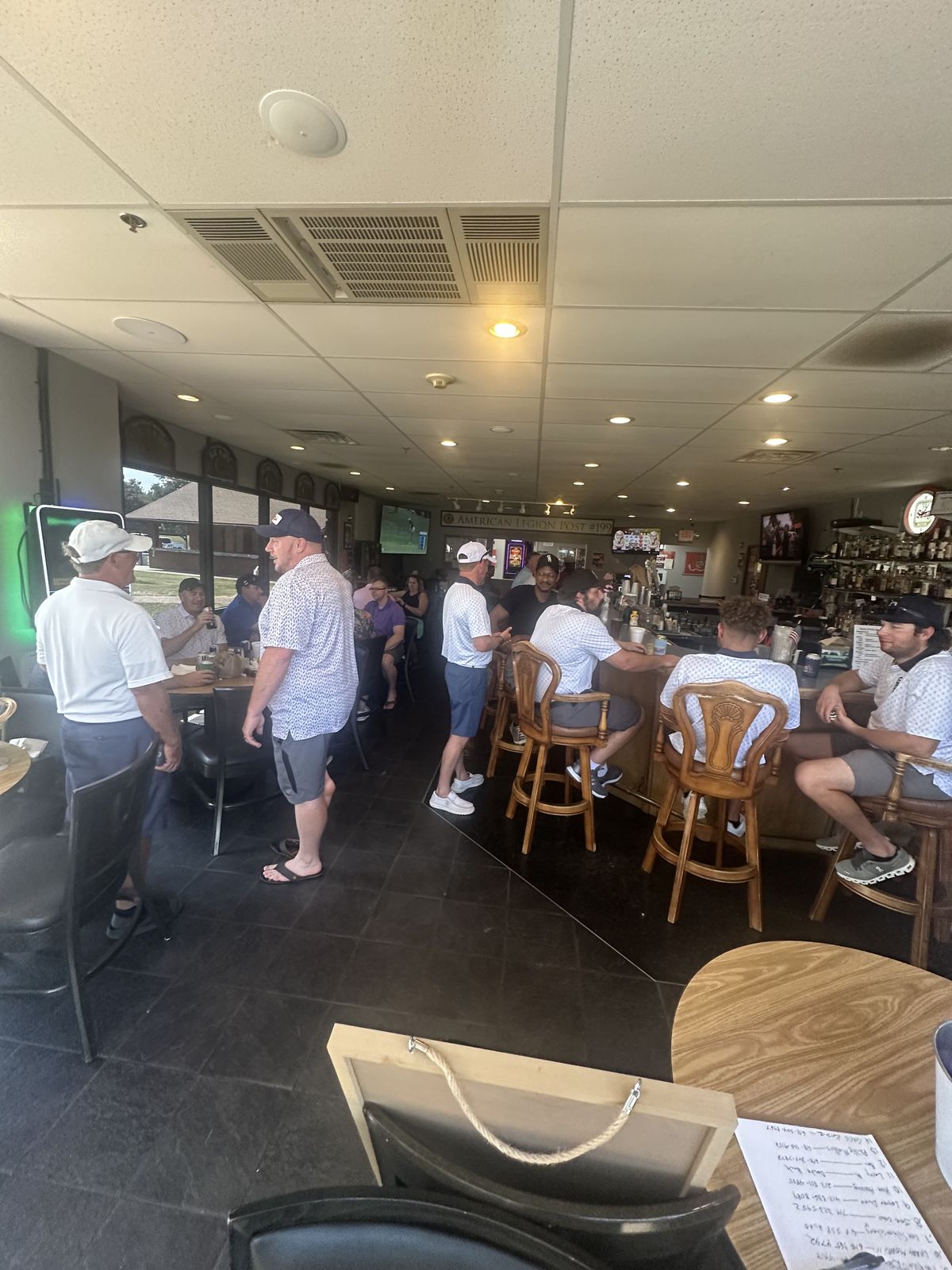 Golfers gather at the American Legion Post 199 clubhouse after a past Aid for Adonai golf scramble