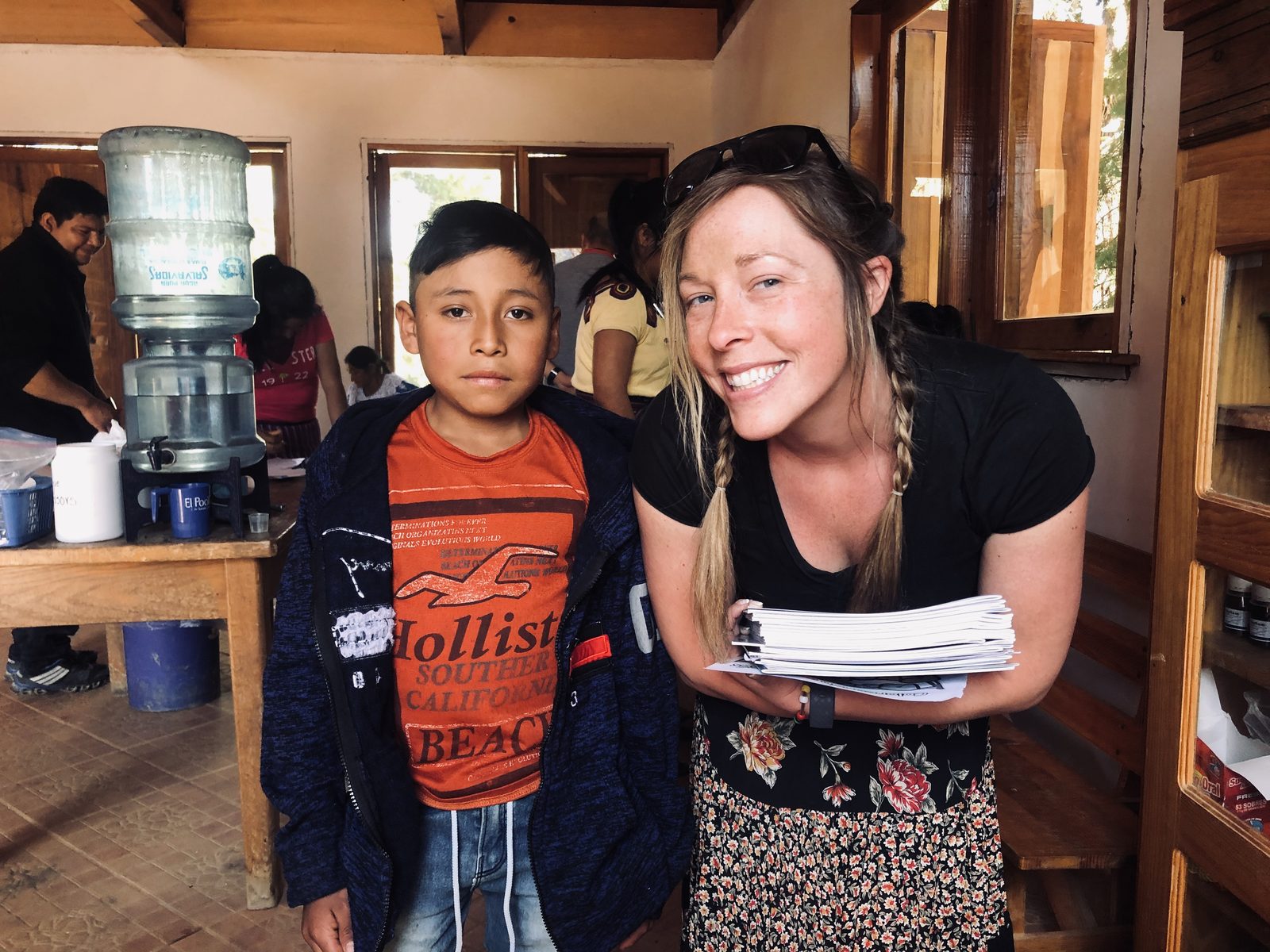 A volunteer with a young patient inside the Adonai clinic in Canillá, Guatemala